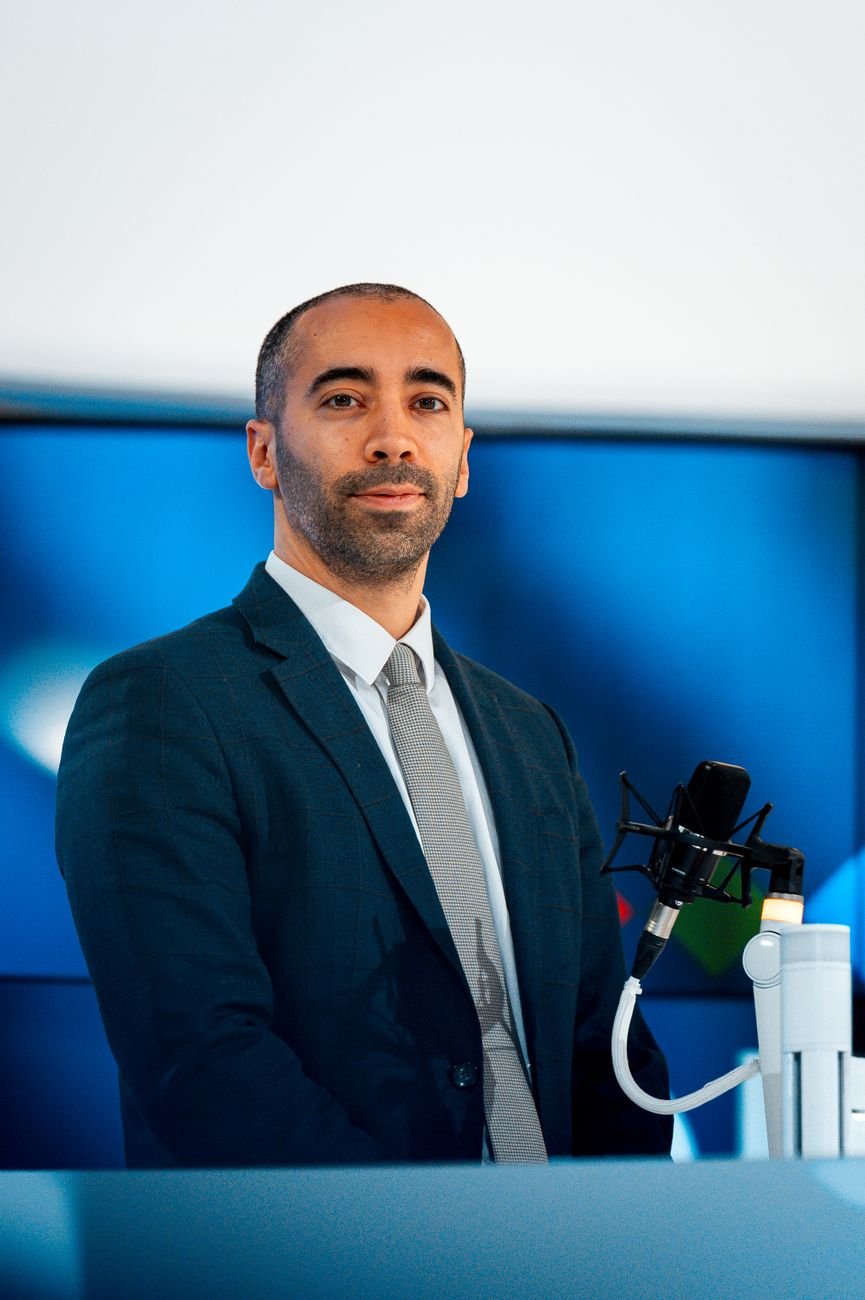 Professional speaker at conference with microphone